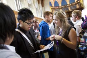 Students and employers at a careers fair in the Great Hall of the Wills Building