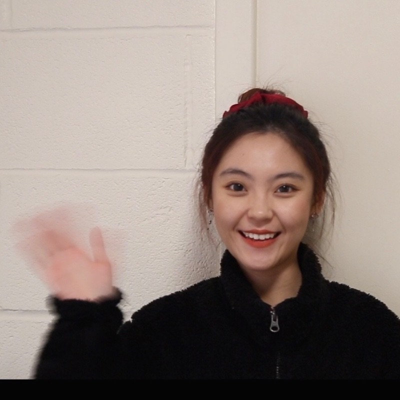a picture of Fei waving 
