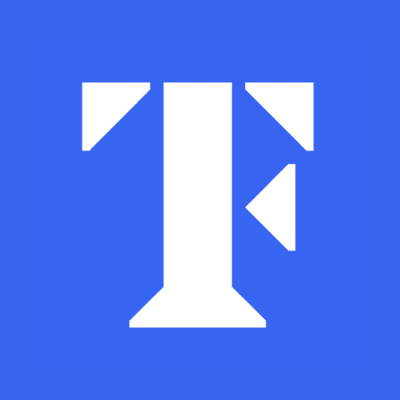 The TeachFirst logo a white conjoined  "T" and "F" on a blue background