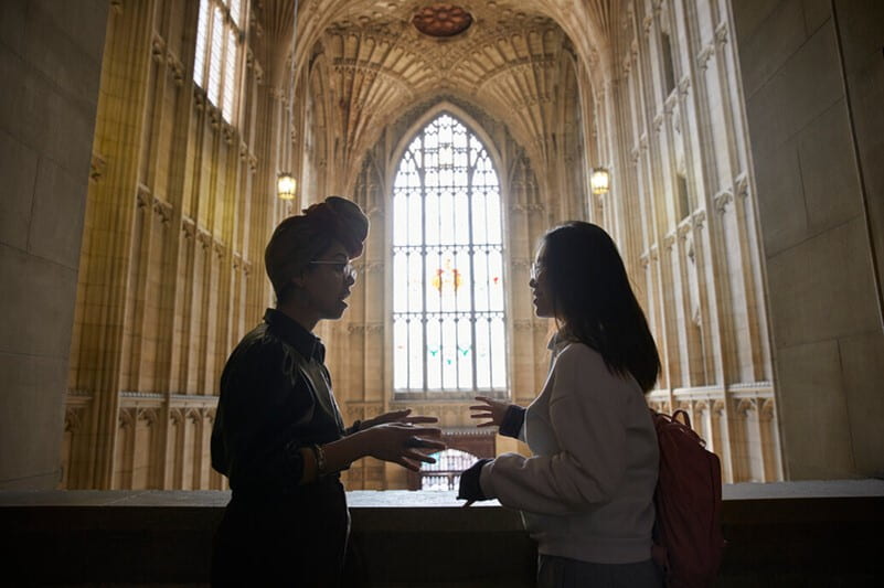 Two students talk in the Wills Memorial building