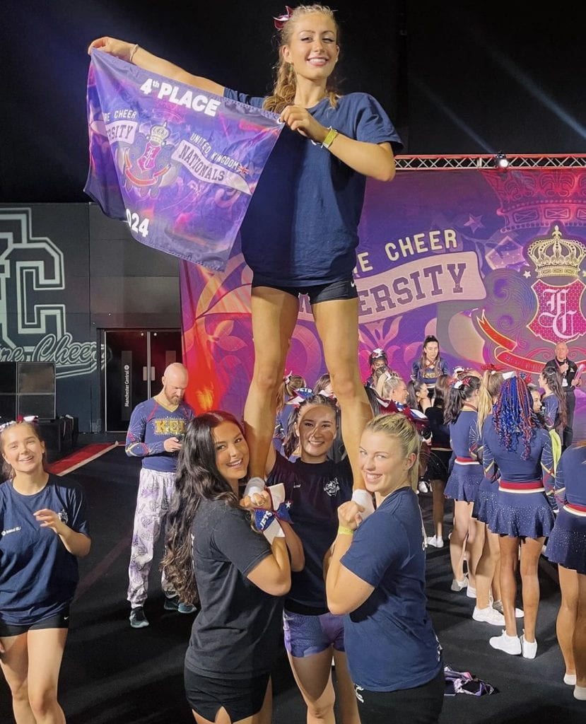 The Bristol Jets team in a pyramid holding up a 4th place banner